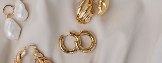 Gold jewelry piece by Aphrolux showcasing elegant craftsmanship and timeless design.