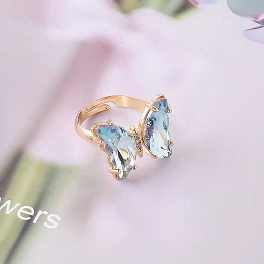 | Adjustable Gold-plated Sky Blue Crystal Butterfly RingAfrican and Caribbean inspired by Jewellery and accessories | African Jewellery | Caribbean jewellery | Afro-Caribbean accessories | African jewelry